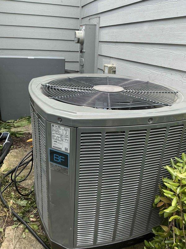 Installed a complete Trane XR13 R410a air conditioning system consisting of a 4TTR3042 outdoor condenser unit positioned on a concrete pad against the building exterior and a TAC42C1N indoor evaporator coil integrated with the existing air handler in the basement. The installation included a new thermostatic expansion valve (TXV) for proper refrigerant metering and a P200 pad for the outdoor unit, with all electrical connections completed and refrigerant lines properly insulated and secured.
