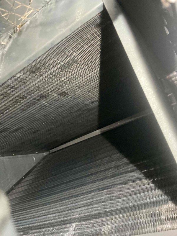 Responded to after hours service call for HVAC system inspection. Upon arrival, accessed air handler unit and performed visual inspection of evaporator coil assembly and electrical components. Coils found in clean operational condition with no visible debris or damage to aluminum fins. Inspected control board, transformer, and capacitor within electrical compartment. All wiring connections appeared secure with no signs of overheating or deterioration. Photographed equipment for documentation purposes. System components verified to be in normal working condition at time of inspection.