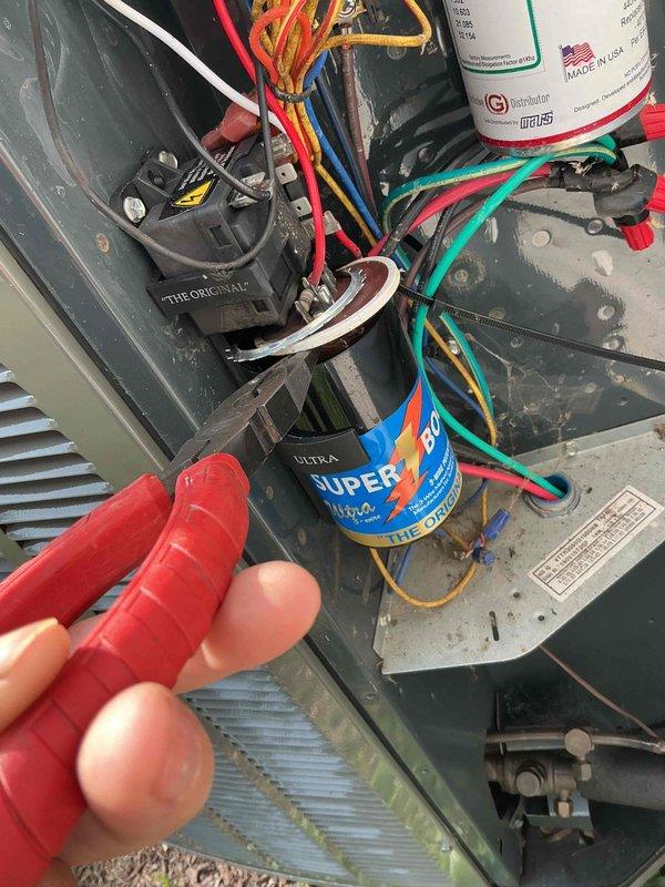 Responded to no cooling complaint following recent repairs with loud noise reported by client. Performed diagnostic testing of electrical components and measured system amperage at 16.96A. Inspected capacitor, relay, and wiring connections inside unit, documenting conditions with before and after photos as requested by client.