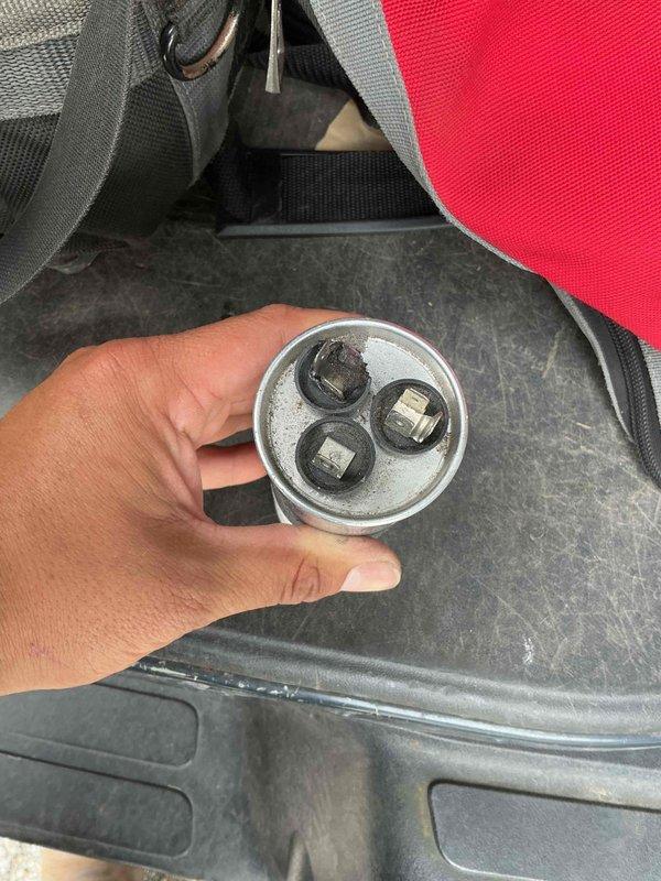 Responded to no-cooling complaint where system was blowing air but not producing cool air, with indoor temperature reaching 79°F despite thermostat set to 74°F. Diagnosed and replaced failed dual-run capacitor, which showed signs of electrical failure. Verified proper electrical connections to compressor and condenser fan motor, tested system operation, and confirmed unit now cooling properly with appropriate temperature differential.