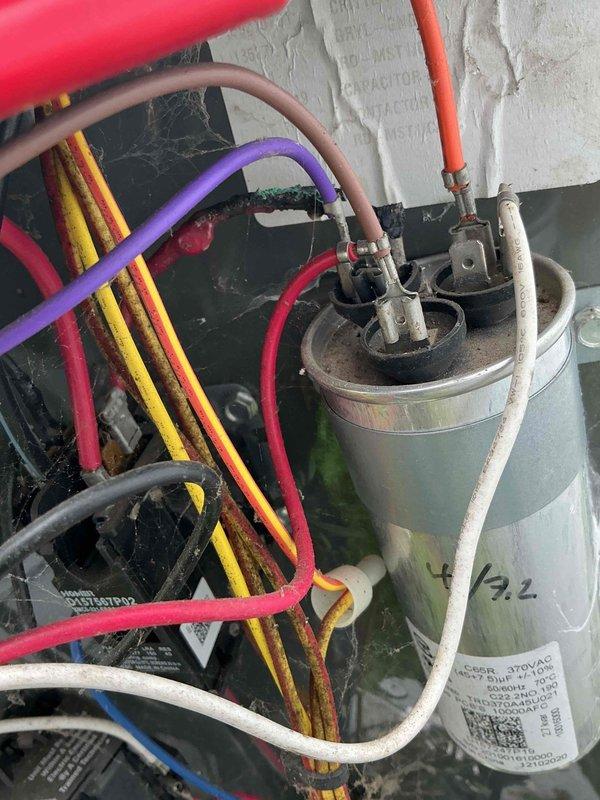 Responded to no-cooling complaint where system was blowing air but not producing cool air, with indoor temperature reaching 79°F despite thermostat set to 74°F. Diagnosed and replaced failed dual-run capacitor, which showed signs of electrical failure. Verified proper electrical connections to compressor and condenser fan motor, tested system operation, and confirmed unit now cooling properly with appropriate temperature differential.