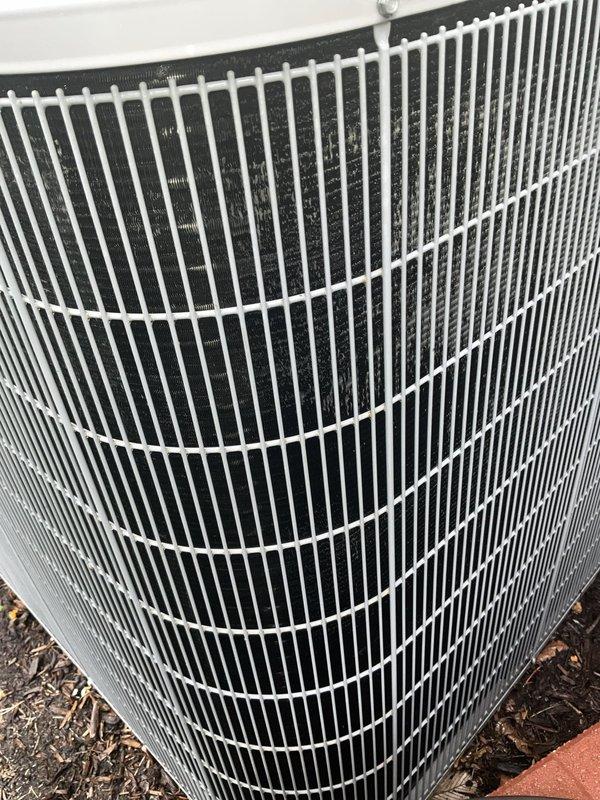 Completed comprehensive BFMA tune-up service on 15-year-old Carrier air conditioning system. Performed full preventive maintenance including inspection of outdoor condenser unit, verified proper operation of all components, checked electrical connections at disconnect and meter, and confirmed system is operating within manufacturer specifications. Unit showed good overall condition with clean coil fins and properly functioning fan assembly.