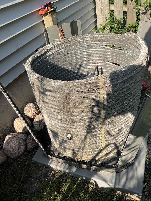 Completed comprehensive BFMA tune-up on a 4-year-old residential air conditioning system that was previously experiencing no-cool conditions. Performed thorough inspection of indoor air handler unit, accessing and examining blower wheel assembly and internal ductwork components for proper airflow and cleanliness. Removed exterior panels from outdoor condenser unit to inspect condenser coil, which showed significant dust accumulation and dirt buildup on fins requiring attention. Cleaned condenser coil to restore proper heat exchange efficiency and airflow through the unit. Verified blower wheel operation and checked all accessible system components for proper function. System restored to optimal operating condition following complete tune-up procedures.