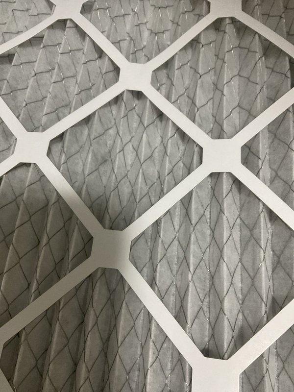 Completed comprehensive BFMA tune-up service on residential air conditioning system with equipment age of 2+ years. Performed standard AC maintenance protocol including system inspection, temperature differential measurements recording 58°F at supply register, and filter evaluation. Inspected and documented clean air filtration system with diamond-pattern pleated filters in good operational condition showing no debris accumulation or damage.