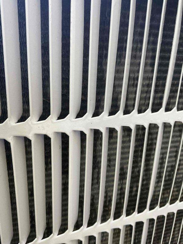 Completed comprehensive BFMA tune-up on 6-year-old air conditioning system, including inspection of condenser coil fins and evaporator unit. Inspected condenser coil which showed good condition with minimal debris accumulation between fins, and documented interior of air handler where organic debris and leaves were present in drain pan requiring attention. Performed standard preventive maintenance checks on all accessible components including refrigerant lines and electrical connections to ensure optimal system performance.