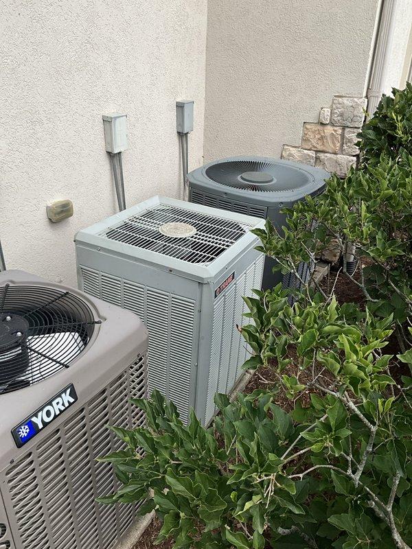 Completed comprehensive AC tune-up on 18-year-old York system located in attic with outdoor condenser unit. Performed full system inspection including refrigerant levels, electrical connections, capacitor testing, coil cleaning, condensate drain verification, and thermostat calibration. All components operating within manufacturer specifications at time of service; provided assessment regarding system age and remaining service life to assist with maintenance versus replacement decision.