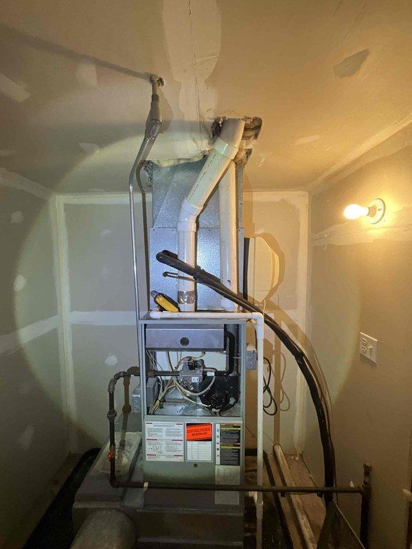 Completed comprehensive AC tune-up on 18-year-old York system located in attic with outdoor condenser unit. Performed full system inspection including refrigerant levels, electrical connections, capacitor testing, coil cleaning, condensate drain verification, and thermostat calibration. All components operating within manufacturer specifications at time of service; provided assessment regarding system age and remaining service life to assist with maintenance versus replacement decision.