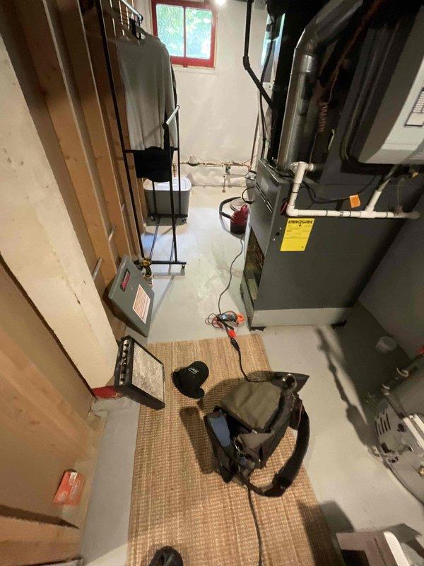 Responded to no cooling call at residential property. Upon arrival, inspected thermostat and HVAC system in basement utility area. Examined Emerson control board and found system displaying "IdL" (idle) status with all components appearing normal. Tested thermostat operation and system controls - no trouble found with equipment. System powered on successfully and operated as designed. All electrical connections, relays, and control board functions tested within normal parameters.