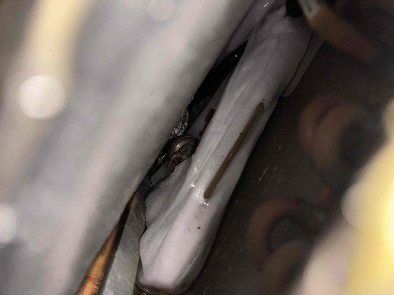 Completed non-member air conditioning tune-up maintenance service on residential split system. Removed bird's nest from interior vent above air handler unit, inspected refrigerant lines for leaks and proper insulation noting condensation present on copper tubing, and performed standard preventative maintenance on outdoor condenser unit including cleaning coils and checking fan operation. All components tested and system operating within normal parameters upon completion.