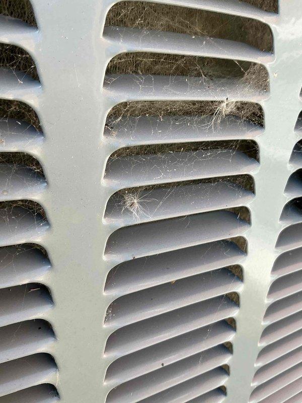 Completed comprehensive BFMA air conditioning tune-up on 4-year-old system per recurring maintenance agreement. Replaced heavily soiled air filter showing significant dust and debris accumulation throughout pleated media. Cleaned exterior condenser grille which exhibited cobwebs, dirt buildup, and weathering from outdoor exposure. Performed standard preventive maintenance inspection including system operational checks, refrigerant level verification, electrical connection testing, and component performance evaluation to ensure optimal efficiency and reliability for continued operation.