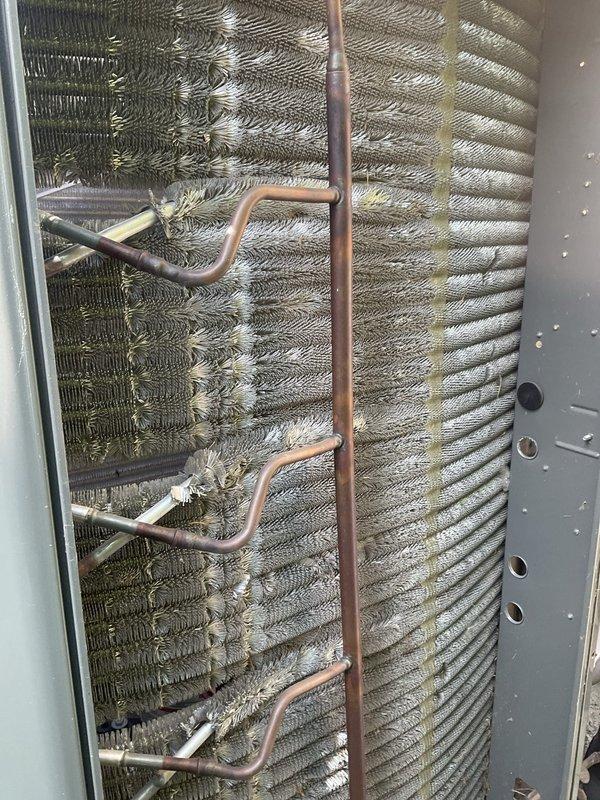 Completed routine BFMA preventative maintenance tune-up on two-year-old residential air conditioning system. Performed comprehensive inspection of outdoor condensing unit, including examination of electrical components, contactor, capacitor, and wire connections—all found to be secure and functioning properly. Inspected evaporator coil assembly and noted moderate dust and debris accumulation on coil fins; system operational with normal cooling performance maintained throughout service visit.