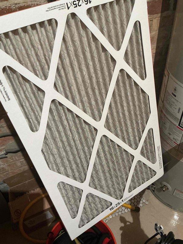 Completed comprehensive BFMA tune-up on 13-year-old air conditioning system, including full inspection of outdoor condenser unit and air handler components. Cleaned condenser coil which showed significant accumulation of dirt, debris, and organic matter between fins, and replaced 16x25x1 air filter. System tested and confirmed operational within manufacturer specifications.
