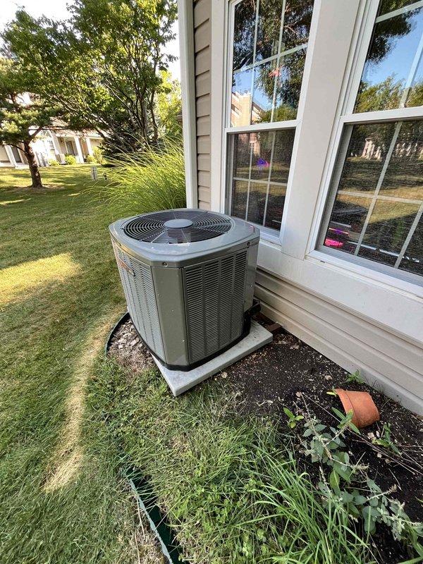 Completed installation of upgraded Trane 5TTR6030 16 SEER air conditioning system with matching ADP upflow/downflow evaporator coil. Removed and reinstalled existing downflow furnace to accommodate the new coil configuration, which required additional clearance due to increased coil height. System installed on exterior concrete pad, charged with refrigerant, tested for proper operation, and verified all connections secure.
