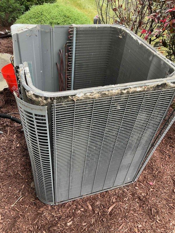 Performed comprehensive BFMA tune-up on 10-year-old residential air conditioning system during afternoon appointment to accommodate tenant schedule. Accessed outdoor condenser unit, removed top panel for internal inspection, and evaluated refrigerant lines and coil assembly condition. Identified heavily corroded capacitor terminals with significant rust accumulation requiring monitoring, inspected electrical control panel components including contactor and wiring connections, cleaned condenser unit exterior showing age-related weathering, and verified all electrical connections secure despite visible corrosion on capacitor. System operational upon completion with recommendations for future capacitor replacement due to terminal deterioration.