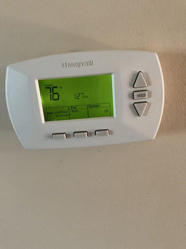 Completed comprehensive BFMA tune-up on residential air conditioning system with 5-year-old equipment. Performed standard maintenance procedures including inspection of blower motor assembly, control board functionality verification, and electrical connections check. Verified Honeywell programmable thermostat operation showing proper temperature control at 76 degrees with system functioning in auto mode, and assessed attic unit layout and accessibility for ongoing maintenance requirements.