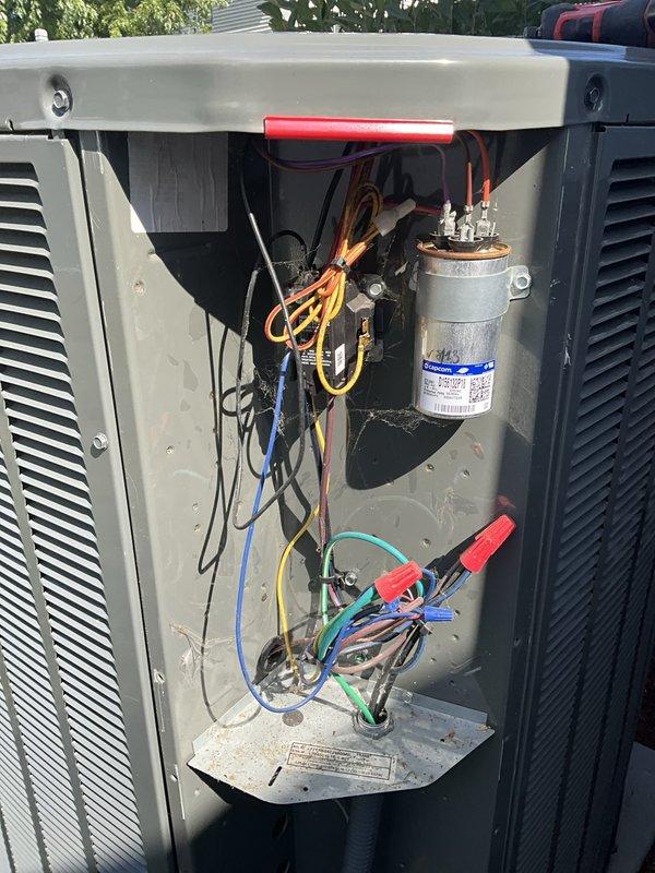 Completed comprehensive BFMA tune-up service on outdoor condensing unit aged 4+ years during afternoon appointment window. Performed full system diagnostics with electrical testing using multimeter on capacitor and related components, inspected all wire connections and electrical systems within cabinet, and documented equipment condition including weathered protective covering material and aged metal fin assembly. Unit operational upon service completion with all findings photographed for customer records.