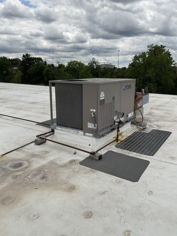 Completed comprehensive tune-up service on four commercial York rooftop package units. Performed standard preventive maintenance procedures including inspection of all mechanical and electrical components, verified operation of Mitsubishi D700 variable frequency drive controls, checked refrigerant line connections, and confirmed proper unit operation. All units found to be functioning within normal parameters upon completion of service.