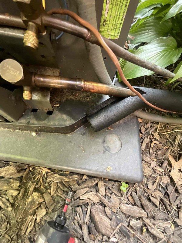 Responded to refrigerant leak on suction line at RLS fitting coupling. Pumped down the system, repaired brazed connection on copper suction line, and installed new suction line filter dryer. Recharged system with R410A refrigerant, verified proper pressures and temperatures, and confirmed unit operation normal upon completion.