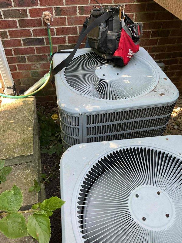 Completed comprehensive BFMA tune-up on dual outdoor condenser units, approximately 13 years old. Performed standard air conditioning maintenance protocol including inspection of both units, cleaning of accumulated organic debris from pressure switch assembly and diamond-shaped access opening, and verification of all electrical connections and wiring. Both condenser units inspected for proper operation, with fan assemblies and heat exchanger fins evaluated for optimal airflow and heat transfer efficiency.