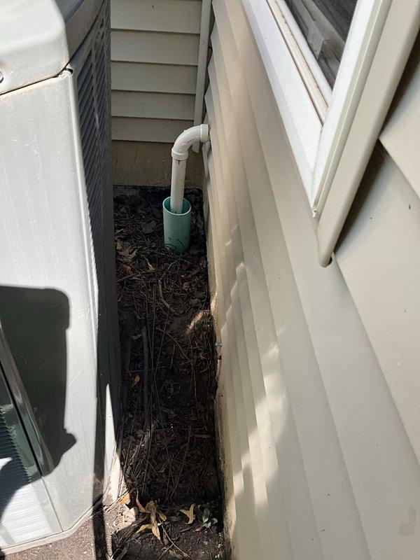Completed comprehensive BFMA tune-up on 8-year-old residential air conditioning system during morning service window. Performed standard preventive maintenance protocol including inspection of outdoor condenser unit, which was found partially obstructed by overgrown vegetation requiring clearance for proper airflow and system efficiency. Verified drainage system operation and inspected exterior PVC condensate lines for proper function and secure mounting along foundation area.