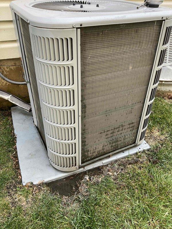 Completed comprehensive BFMA air conditioning tune-up on 8-year-old residential outdoor condensing unit. Performed standard maintenance protocol including inspection of all major components, cleaning of condenser coils and exterior surfaces which showed significant dust and debris accumulation, verified refrigerant levels, tested electrical connections and disconnect box, checked fan motor operation, and confirmed proper system operation. Unit returned to optimal performance with improved airflow efficiency following cleaning of heavily soiled mesh grille panels and condenser fins.