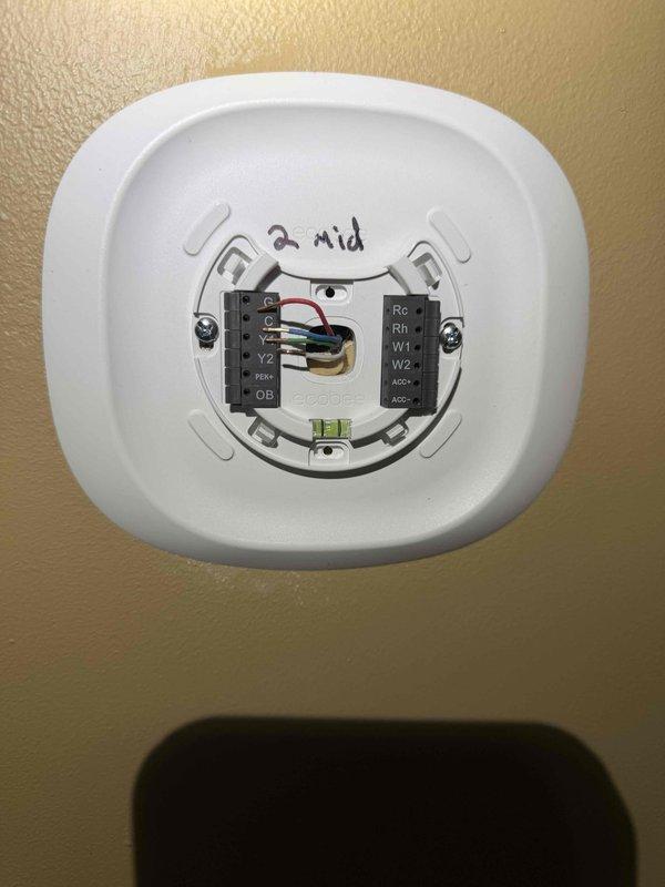 Installed two ecobee smart thermostats at customer request, completing wiring connections and mounting on second and third floor locations. All units tested and operational upon completion, with proper terminal connections verified for HVAC system control.