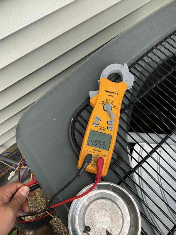Completed comprehensive air conditioning tune-up on a 4-year-old residential system. Performed full system inspection including blower wheel assembly examination, electrical connections testing with amp draw readings of 49.55, and verification of all operational components. All equipment found operating within normal parameters with routine maintenance successfully completed.