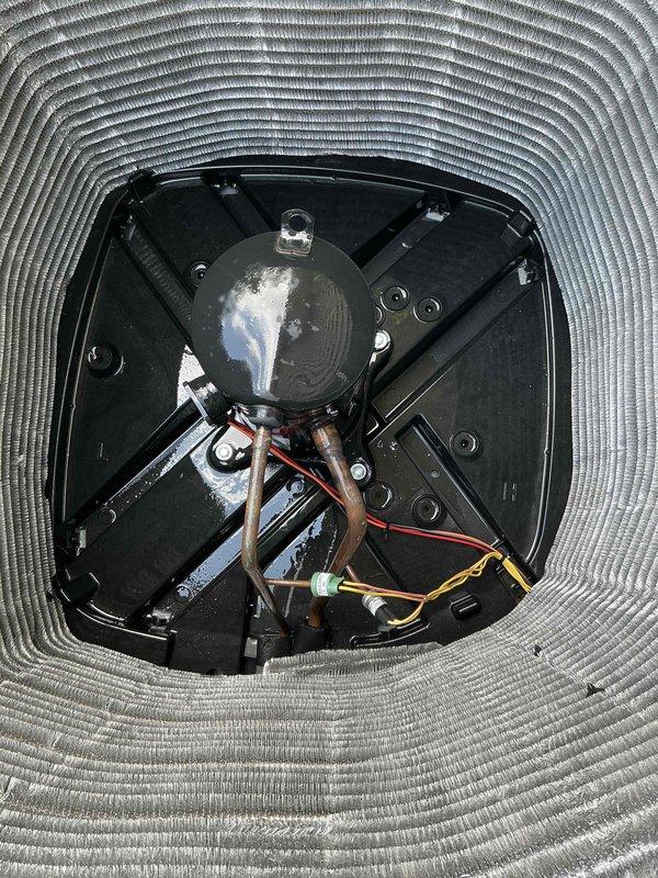 Completed comprehensive BFMA tune-up on one-year-old air conditioning system. Performed detailed inspection of condenser unit, noting moderate dust and debris accumulation on exterior coil fins and oxidation present on copper refrigerant lines. Accessed and inspected blower motor assembly, fan blades, and electrical connections within air handler unit, confirming all components operational and properly secured.