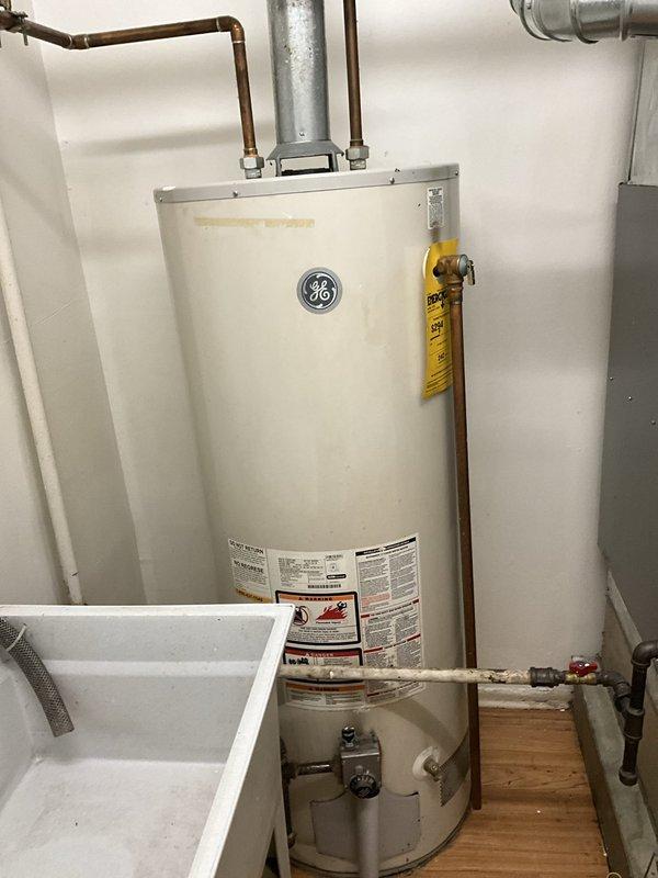 Completed comprehensive BFMA tune-up service on residential HVAC system with equipment aged 4+ years. Performed standard air conditioning maintenance including inspection of furnace unit, ductwork connections, and mechanical components. Investigated reported missing PVC pipe in attic related to master bedroom system and inspected GE water heater to provide replacement assessment per customer request.