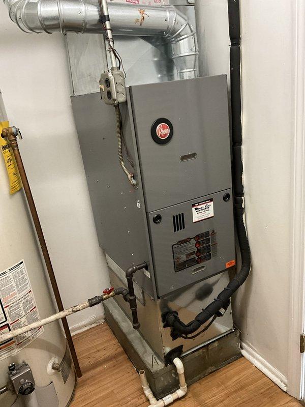 Completed comprehensive BFMA tune-up service on residential HVAC system with equipment aged 4+ years. Performed standard air conditioning maintenance including inspection of furnace unit, ductwork connections, and mechanical components. Investigated reported missing PVC pipe in attic related to master bedroom system and inspected GE water heater to provide replacement assessment per customer request.
