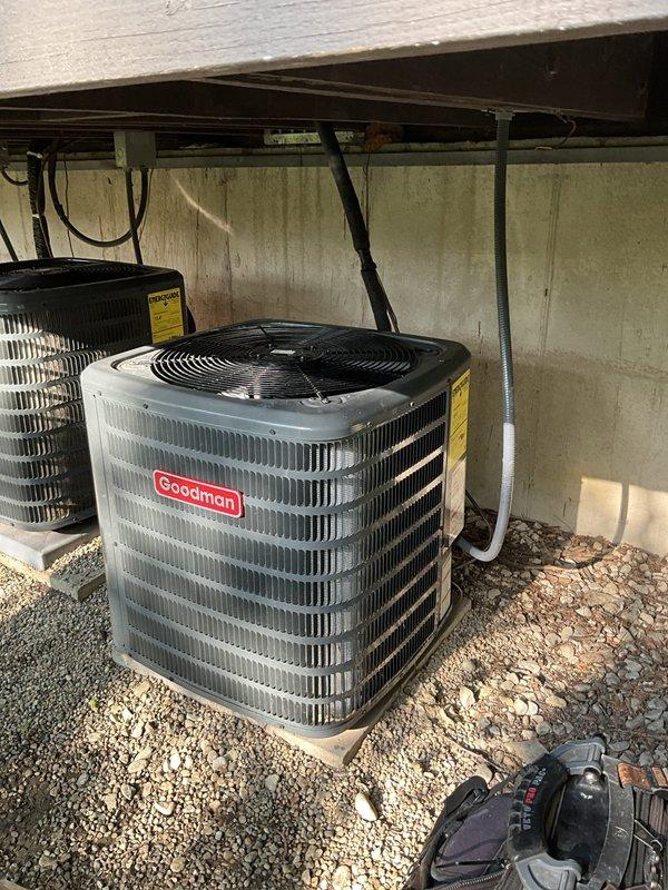 Responded to no cooling call on one-year-old Goodman residential system that had been previously serviced 4-5 times by installing contractor without resolution. Upon inspection, discovered evaporator coil completely frozen with extensive ice buildup on refrigerant lines and surrounding surfaces. Identified restricted airflow as root cause due to severely clogged air filter and inadequate return air, causing coil temperature to drop below freezing point. Shut down system to allow coil to thaw completely, replaced air filter, verified proper airflow across evaporator, and checked refrigerant charge levels. Once thawed, restarted system and confirmed proper operation with adequate cooling and no further ice formation. Educated homeowner on importance of regular filter changes and proper system maintenance to prevent recurrence.