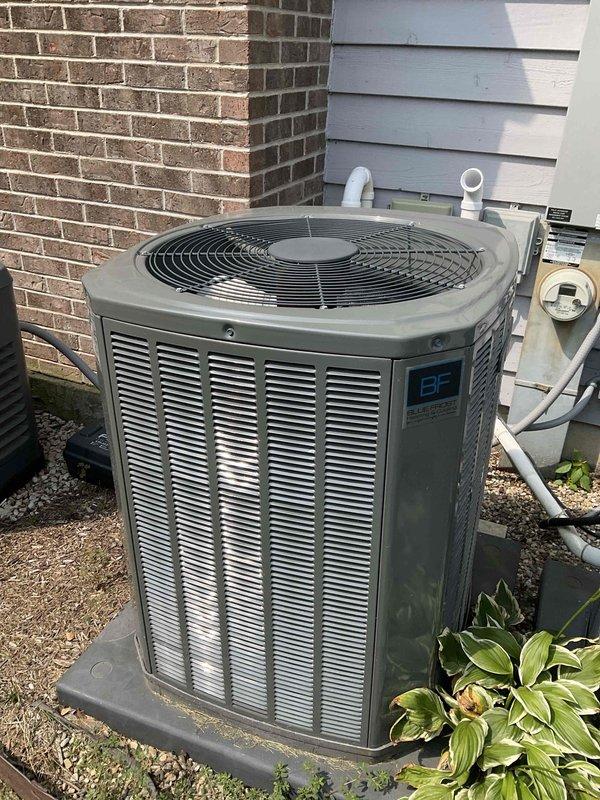 Completed comprehensive BFMA tune-up on 7-year-old residential air conditioning system. Performed full inspection of outdoor condenser unit, noting visible algae and organic growth accumulation on coil fins requiring cleaning attention. Verified proper unit operation, checked refrigerant levels, inspected electrical connections at disconnect box, confirmed condensate drain lines are clear and functioning properly, and ensured adequate airflow through coils for optimal system performance.
