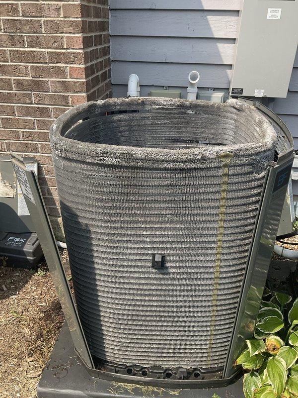 Completed comprehensive BFMA tune-up on 7-year-old residential air conditioning system. Performed full inspection of outdoor condenser unit, noting visible algae and organic growth accumulation on coil fins requiring cleaning attention. Verified proper unit operation, checked refrigerant levels, inspected electrical connections at disconnect box, confirmed condensate drain lines are clear and functioning properly, and ensured adequate airflow through coils for optimal system performance.