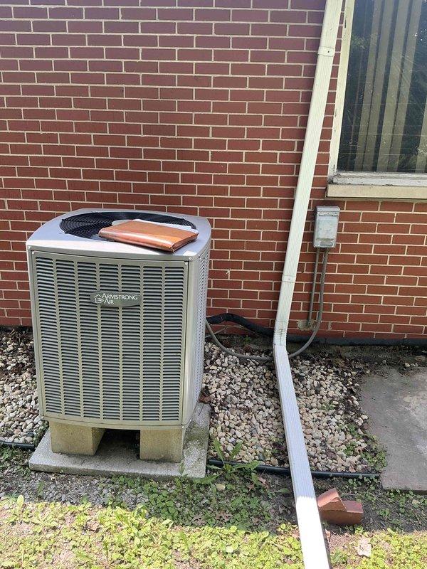 Provided comprehensive estimate for complete air conditioning system replacement including outdoor condensing unit and indoor evaporator coil. Evaluated existing Armstrong Air outdoor unit showing significant weathering and age-related deterioration, along with current indoor HVAC equipment in basement utility area. Discussed available warranty options and financing programs to facilitate system upgrade decision.