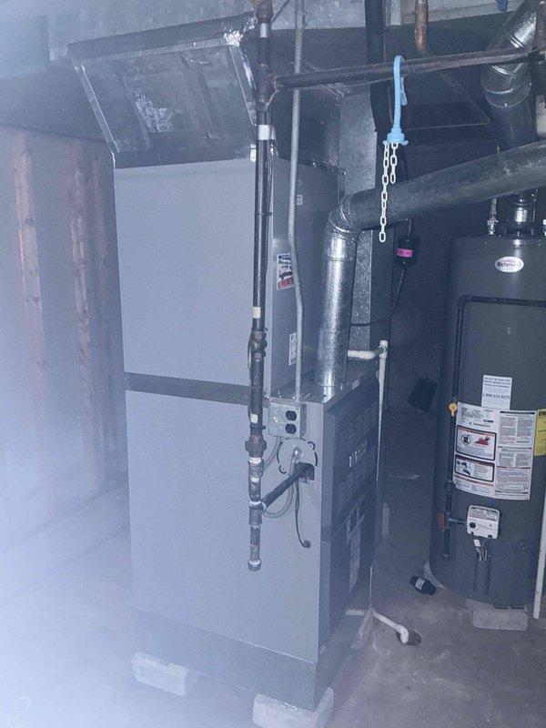 Provided comprehensive estimate for complete air conditioning system replacement including outdoor condensing unit and indoor evaporator coil. Evaluated existing Armstrong Air outdoor unit showing significant weathering and age-related deterioration, along with current indoor HVAC equipment in basement utility area. Discussed available warranty options and financing programs to facilitate system upgrade decision.