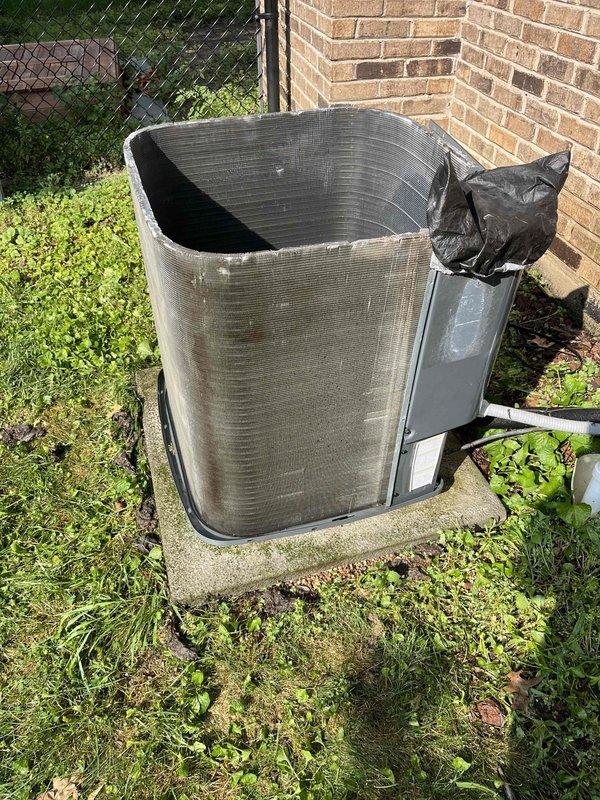 Completed comprehensive BFMA tune-up on outdoor AC condenser unit aged 10+ years. Performed standard maintenance protocol including inspection of condenser coils, which showed significant dirt and debris accumulation on aluminum fins, though structural integrity remained intact. Documented equipment condition through photographic records showing outdoor unit positioned on concrete pad with visible environmental contamination requiring attention during routine maintenance cycle.