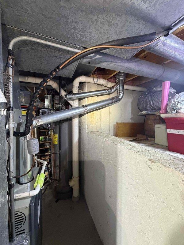 Installed 6 x 4 x 3 wye tee fitting in basement ductwork system along with additional 3-inch and 4-inch elbows to properly reconnect to existing duct runs. Replaced failed contactor on HVAC unit and evacuated system before charging with refrigerant to manufacturer specifications. All ductwork connections were secured and sealed, electrical connections tested for proper operation, and system verified operational with adequate airflow through modified duct configuration.