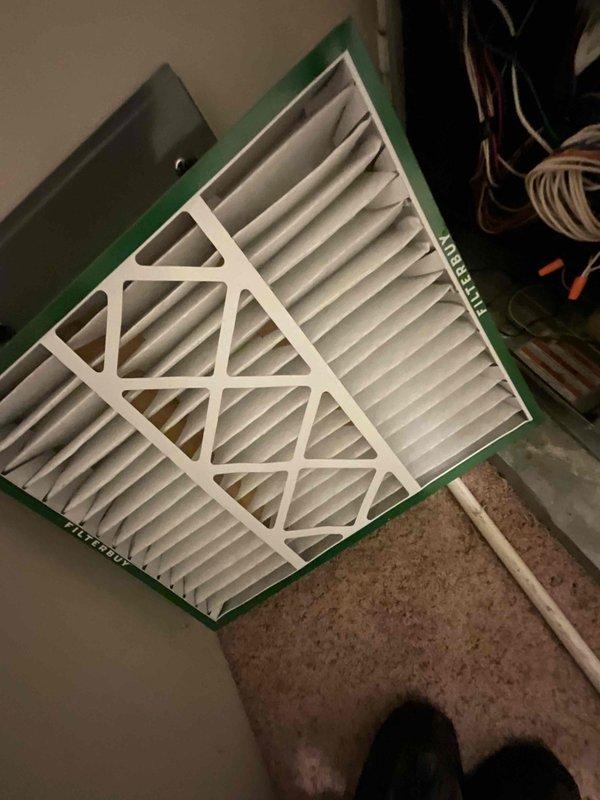 Completed comprehensive BFMA tune-up service on three air conditioning units, all approximately 11 years old. Inspected and replaced HVAC air filters with new pleated filters, removing old filters that had reached end of service life. Performed detailed inspection of condenser unit, identifying significant accumulation of organic debris, leaves, and dirt buildup around compressor mounting platform and internal components. Cleaned debris from condenser base area and between mounting brackets to restore proper airflow and prevent potential performance issues. Verified all mechanical components operational and system functioning within normal parameters following maintenance procedures.
