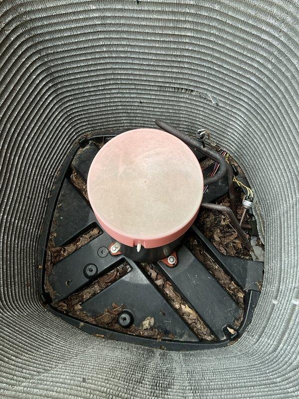Completed comprehensive BFMA tune-up service on three air conditioning units, all approximately 11 years old. Inspected and replaced HVAC air filters with new pleated filters, removing old filters that had reached end of service life. Performed detailed inspection of condenser unit, identifying significant accumulation of organic debris, leaves, and dirt buildup around compressor mounting platform and internal components. Cleaned debris from condenser base area and between mounting brackets to restore proper airflow and prevent potential performance issues. Verified all mechanical components operational and system functioning within normal parameters following maintenance procedures.