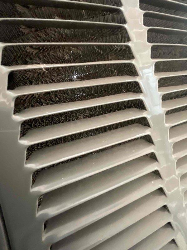 Completed comprehensive AC tune-up on 17-year-old air conditioning system. Inspected and documented heavily soiled return air grille and filter, which showed significant accumulation of dust, lint, and debris restricting airflow. Replaced dirty air filter to restore proper system airflow and efficiency, improving indoor air quality and reducing strain on HVAC components.