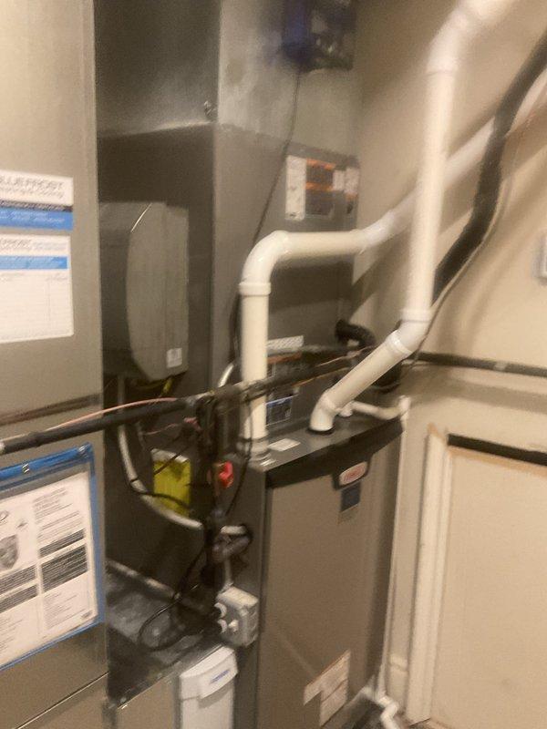 Responded to service call for newly installed A/C unit experiencing water leakage. Upon inspection, advised client to power down system to prevent potential evaporator coil icing and further water damage. Documented equipment installation including indoor air handler, refrigerant lines, and condensate drainage system in mechanical room. Issue documented under warranty for further evaluation and resolution by installation crew.