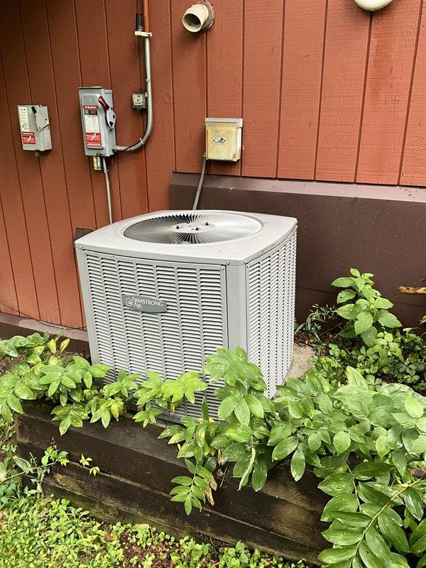 Installed hard start kit on outdoor air conditioning condenser unit to improve compressor starting performance and reduce electrical stress during startup. Accessed unit's electrical compartment, connected hard start capacitor in parallel with existing run capacitor using appropriate wiring, and verified all electrical connections were secure before closing access panel and testing system operation.