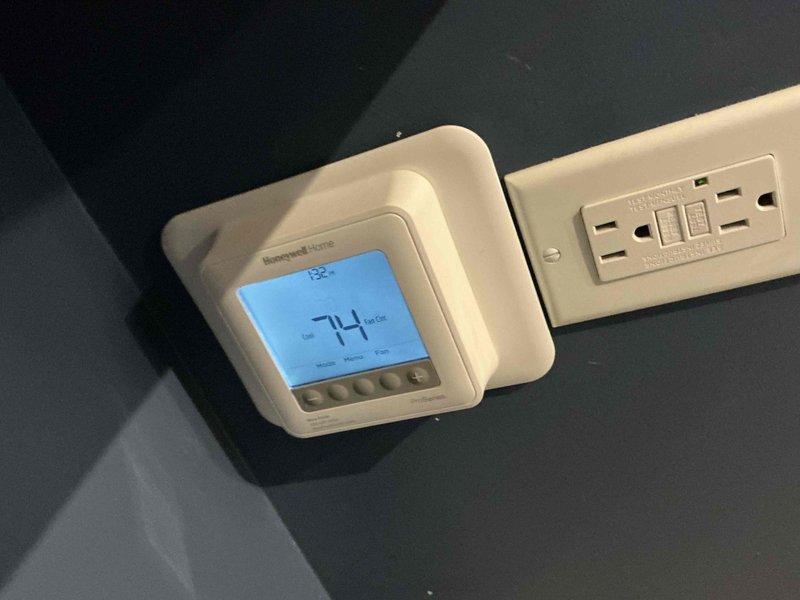 Completed comprehensive BFMA tune-up service on a 2-year-old air conditioning system during afternoon appointment window. Performed standard preventative maintenance procedures including system inspection, thermostat functionality verification at 74°F setpoint, and confirmed proper battery backup operation on Honeywell Home digital thermostat. All equipment operating within normal parameters with no issues identified during service visit.