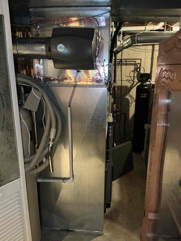 Conducted comprehensive evaluation of residential HVAC system experiencing cooling performance issues. Diagnosed failed compressor requiring replacement. Assessed existing furnace, air handler, and coil assembly in basement installation. Documented equipment condition and refrigerant line configuration. Prepared estimate for complete A/C condenser and evaporator coil replacement to restore proper cooling capacity for yearly maintenance member.