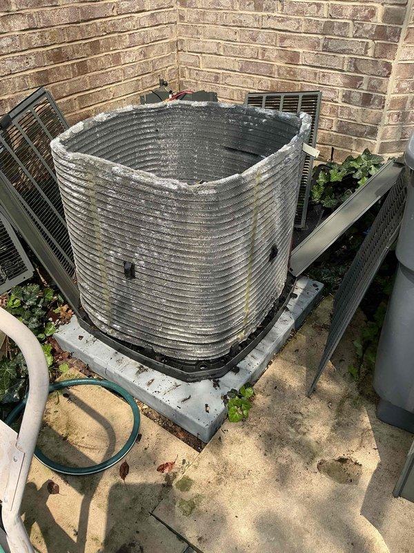 Completed comprehensive BFMA tune-up service on a 3+ year old outdoor air conditioning condenser unit with barrel-style horizontal coil configuration. Upon arrival, found significant dirt and debris accumulation on coil surfaces affecting heat transfer efficiency. Performed thorough system inspection, cleaned condenser coils, verified electrical connections at disconnect box, and tested unit operation to ensure proper cooling performance.