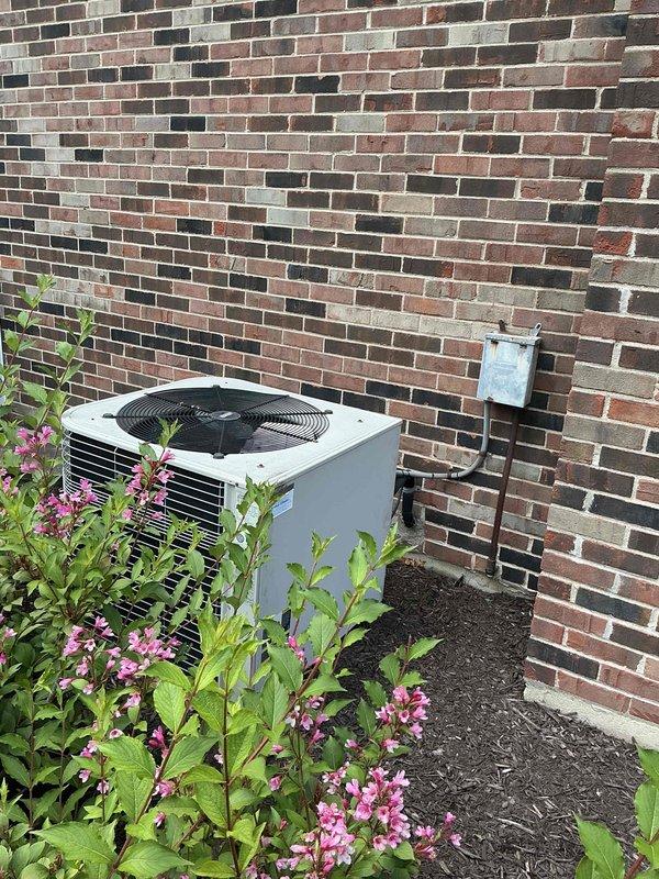 Performed comprehensive evaluation of 23-year-old residential air conditioning system and indoor coil for replacement estimate. Unit currently operational but customer seeking replacement due to age and desire to avoid further investment in aging equipment. Documented existing outdoor condensing unit and indoor evaporator coil configuration, assessed installation location against brick exterior wall with electrical disconnect, and evaluated attic-mounted air handler and ductwork system for compatibility with new equipment specifications.