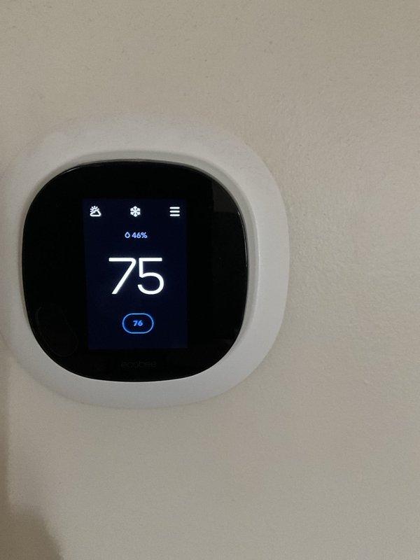 Completed comprehensive BFMA tune-up service including two air conditioning systems, water heater, and dehumidifier for equipment aged 10-15 years. Replaced failed condenser fan motor and blade assembly on one AC unit due to significant damage to internal components, removed damaged housing and control unit from property. Verified thermostat operation displaying 75°F current temperature with 76°F setpoint in cooling mode, confirmed proper system communication and temperature control functionality across all serviced equipment.