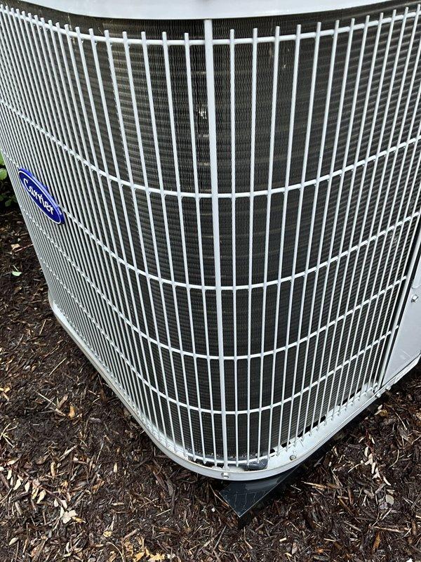 Completed comprehensive BFMA tune-up service on residential air conditioning system with equipment aged 4+ years. Performed standard maintenance protocol including visual inspection of outdoor condenser unit, verified proper airflow through protective grille and mesh screening, and confirmed unit stability on base pad. Conducted electrical diagnostics using calibrated digital multimeter, measuring AC inrush current at 66.11 amps to verify compressor performance and system operation within manufacturer specifications. All components found to be functioning properly with no immediate repairs required.