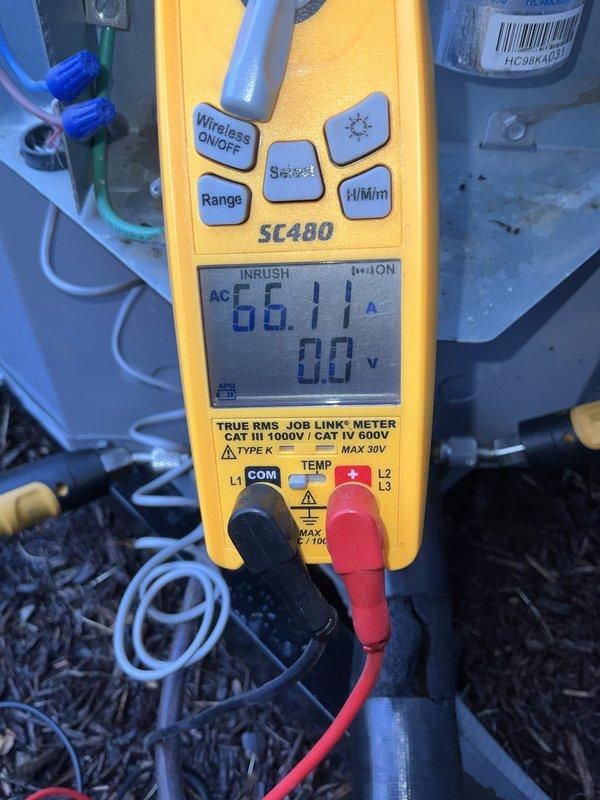 Completed comprehensive BFMA tune-up service on residential air conditioning system with equipment aged 4+ years. Performed standard maintenance protocol including visual inspection of outdoor condenser unit, verified proper airflow through protective grille and mesh screening, and confirmed unit stability on base pad. Conducted electrical diagnostics using calibrated digital multimeter, measuring AC inrush current at 66.11 amps to verify compressor performance and system operation within manufacturer specifications. All components found to be functioning properly with no immediate repairs required.