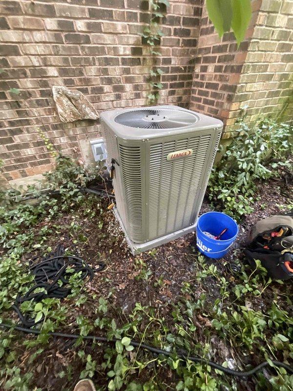 Completed comprehensive BFMA tune-up service on two residential Lennox air conditioning systems. Performed standard maintenance procedures including inspection of outdoor condensing units, cleaning of condenser coils showing dirt accumulation and environmental debris, verification of electrical connections at disconnect box, assessment of refrigerant levels, and testing of system operations. Both units operational and running within manufacturer specifications upon completion.